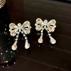 Cute Plated Rhinestone Embellished Bow Motif Drop Earrings - Silver