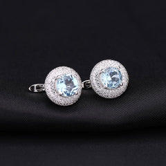 Opulent Blue Topaz Halo Clear Cubic Zirconia Cluster Stud Earrings